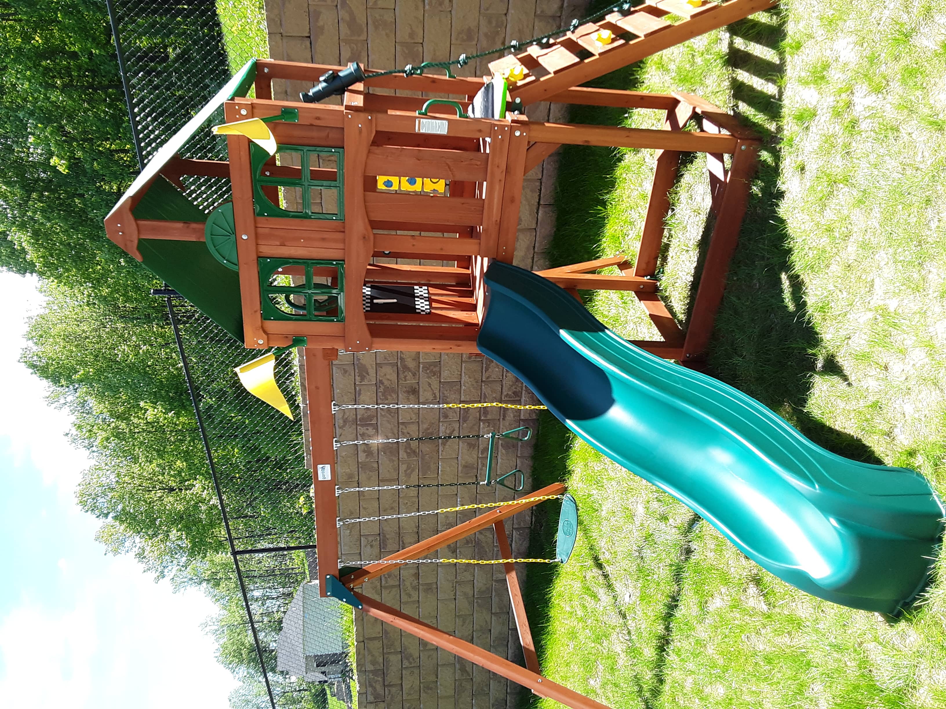 Playset with climbing wall